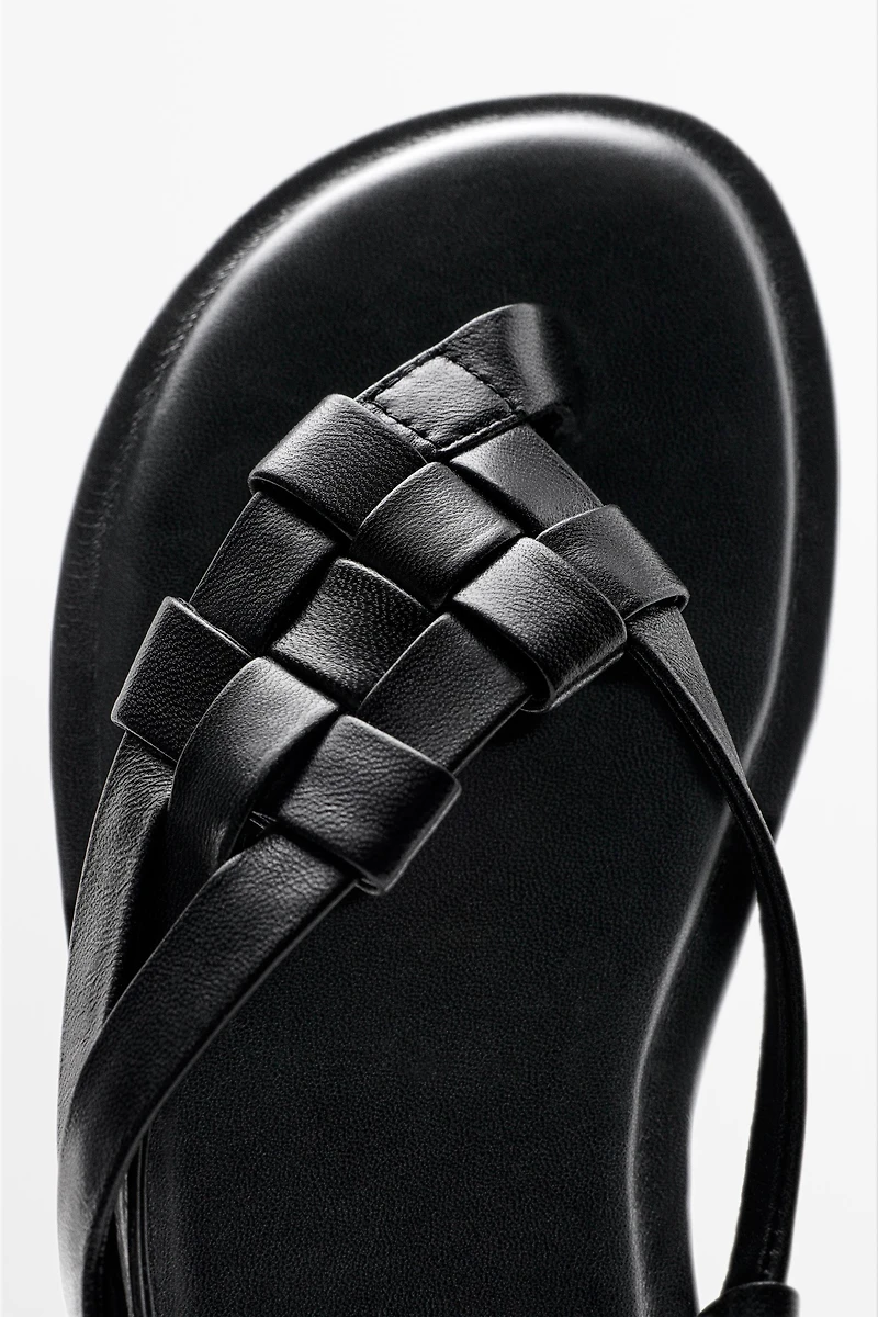 Flat woven leather sandals
