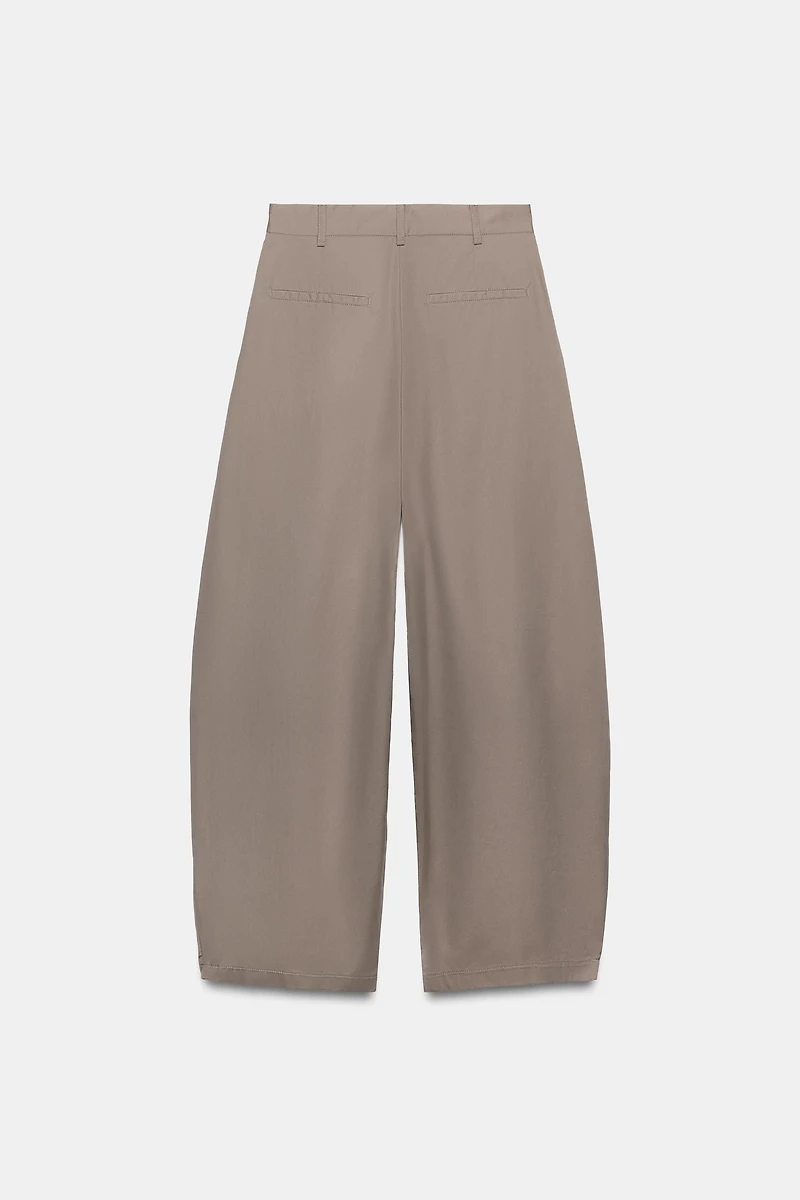 ASYMMETRIC WAIST PLEATED TROUSERS