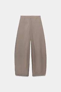 ASYMMETRIC WAIST PLEATED TROUSERS