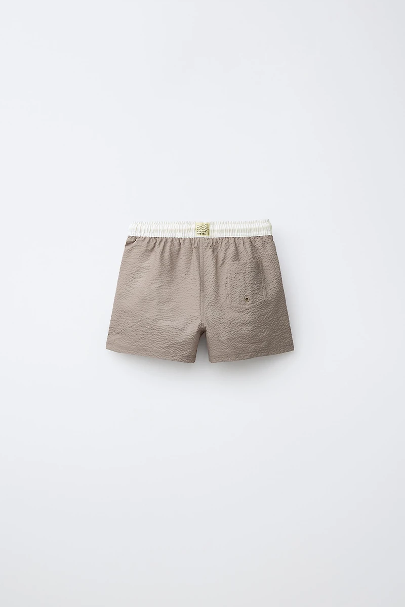 AGES 6-14 / LABEL SWIM SHORTS