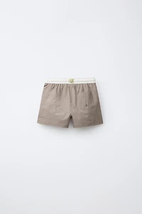 AGES 6-14 / LABEL SWIM SHORTS