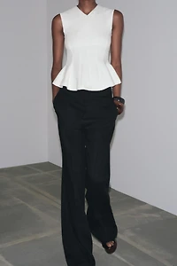 SLEEVELESS INTERLOCK PEPLUM TOP