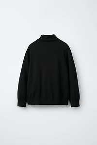 PULL EN MAILLE À COL ROULÉ