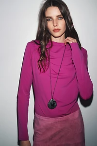 DRAPED SHOULDER PAD TOP