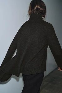 WOOL SWEATER WITH ASYMMETRIC HEM