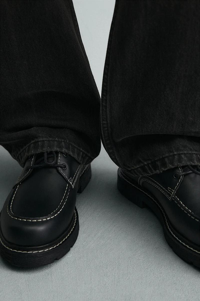 CHAUSSURES EN CUIR AVEC SURPIQÛRES