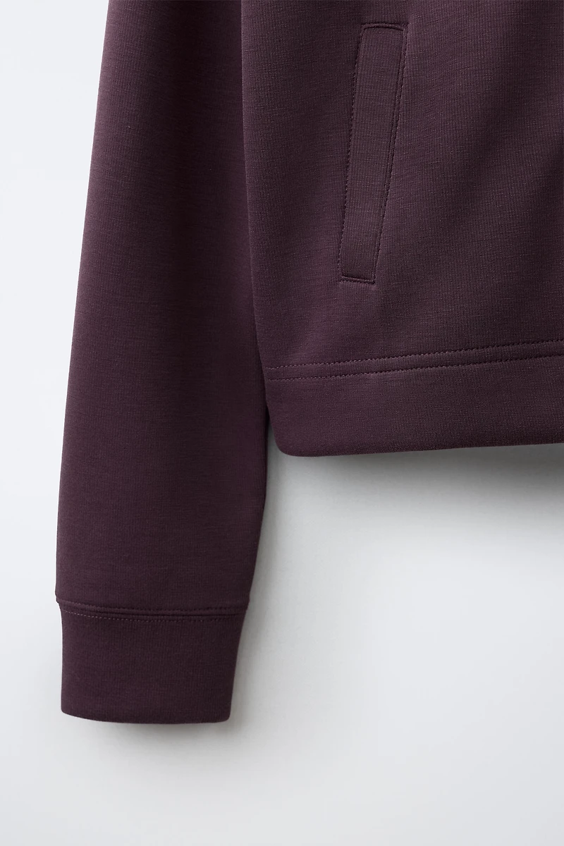VESTE DE SPORT À CAPUCHE