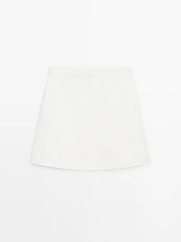 Short denim skirt with seam details