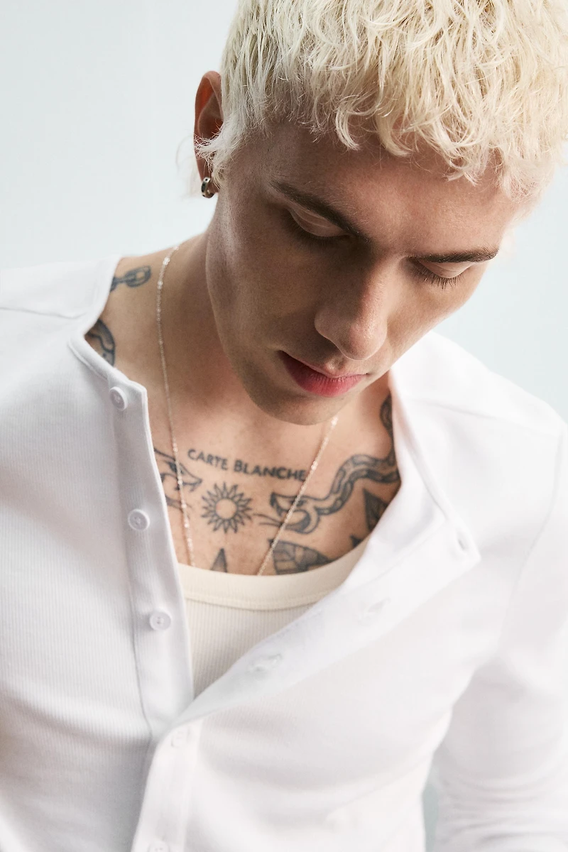RIBBED SHIRT WITH BUTTON NECK