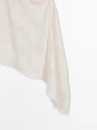 Top with asymmetric neckline