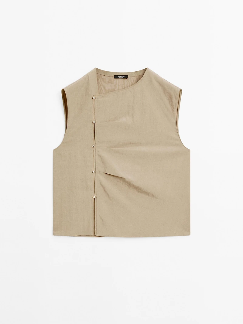 Blouse with silver button fastening on the side