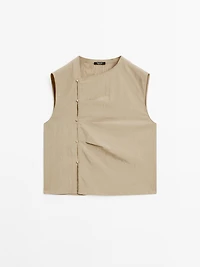 Blouse with silver button fastening on the side
