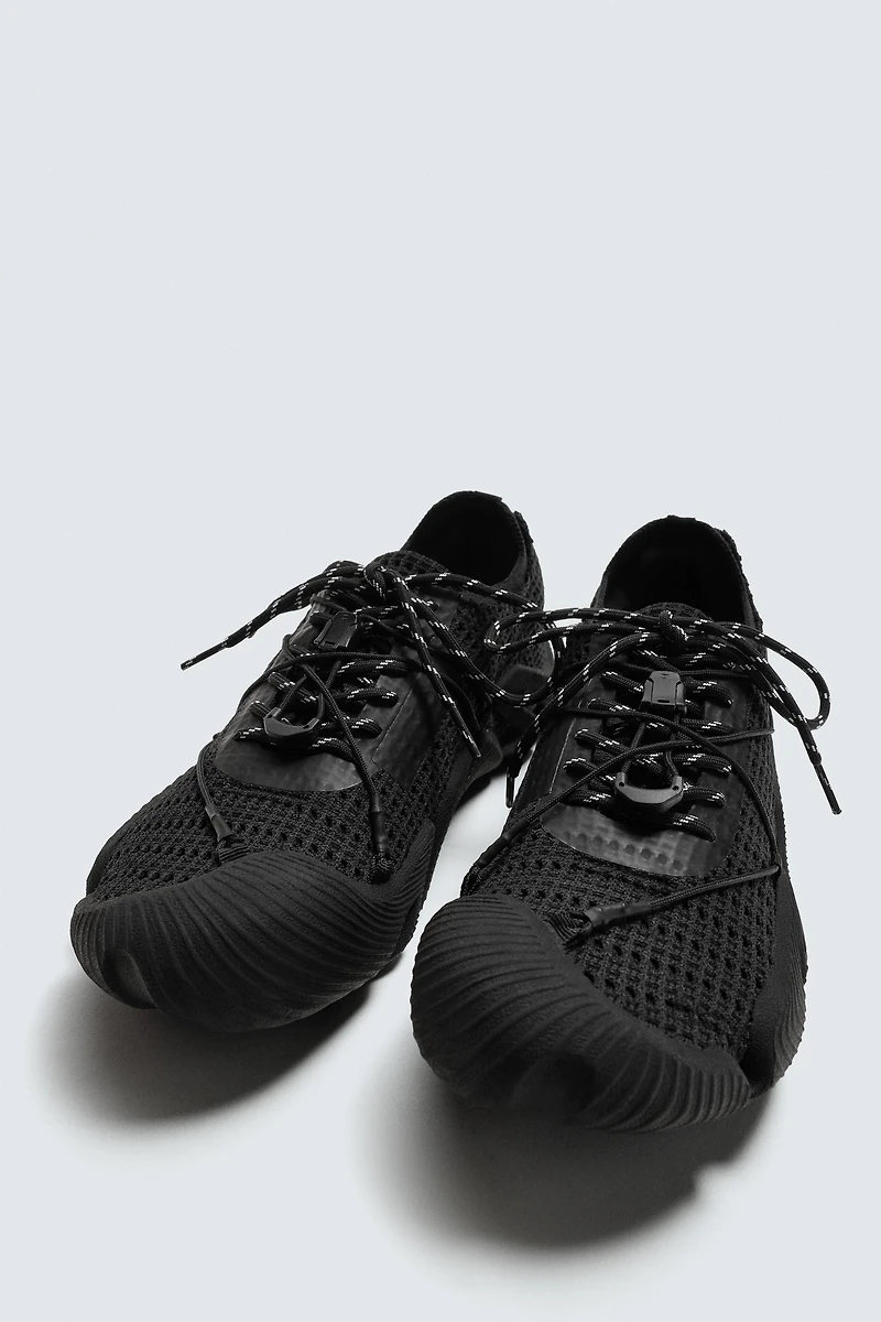 IRREGULAR SOLE SNEAKERS