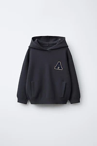 KNIT JUMPER WITH LETTER PATCH