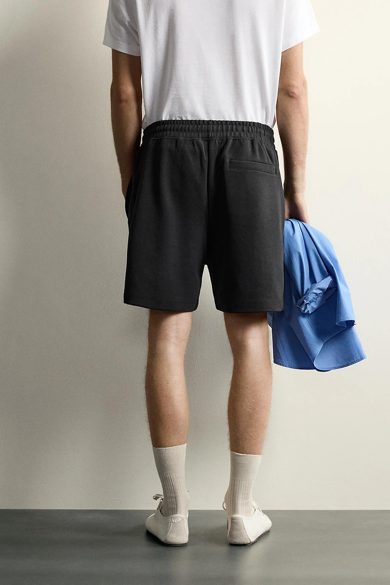 RELAXED FIT INTERLOCK TRACK SHORTS