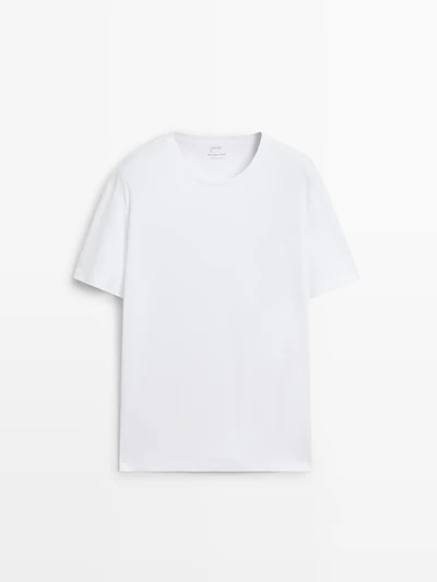 Short sleeve pyjama top and striped trousers