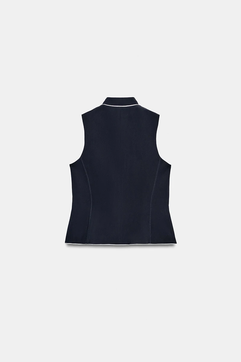 GILET À LISERÉS EN CONTRASTE