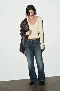 TRF SLUNG LOW-RISE STUDDED JEANS