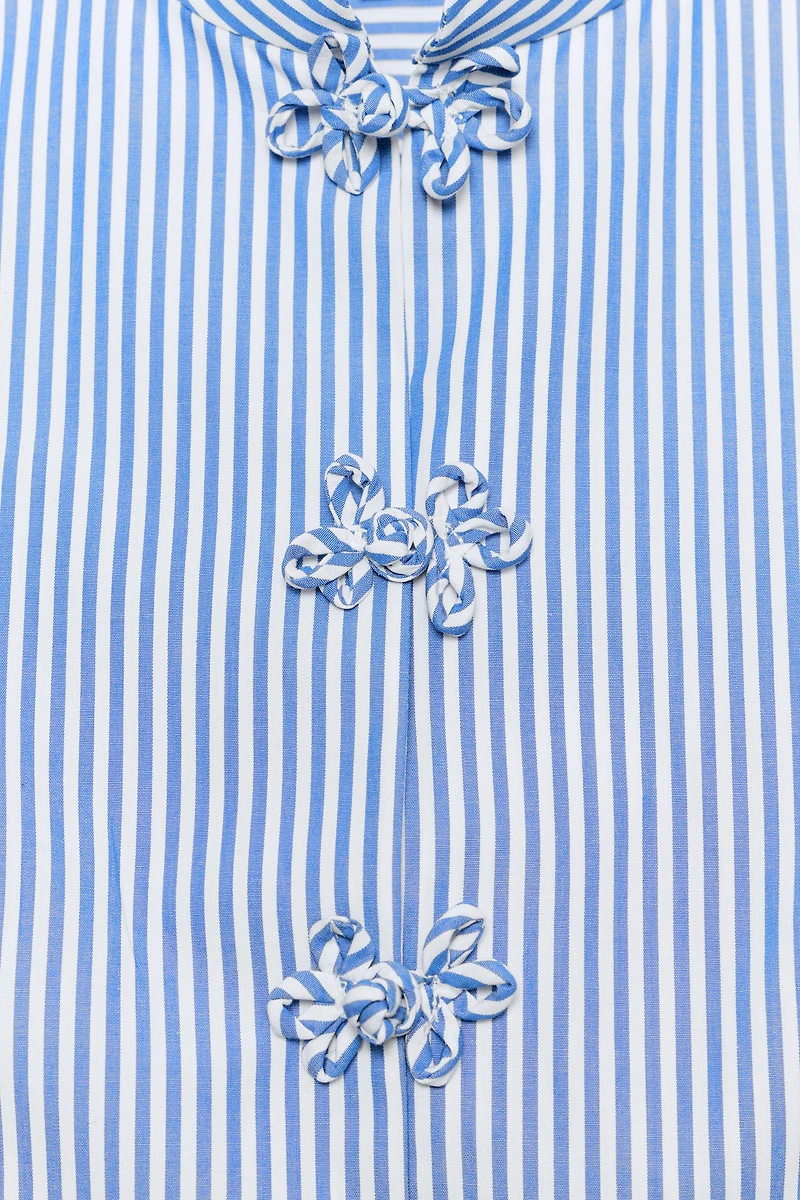 STRIPED PEPLUM SHIRT