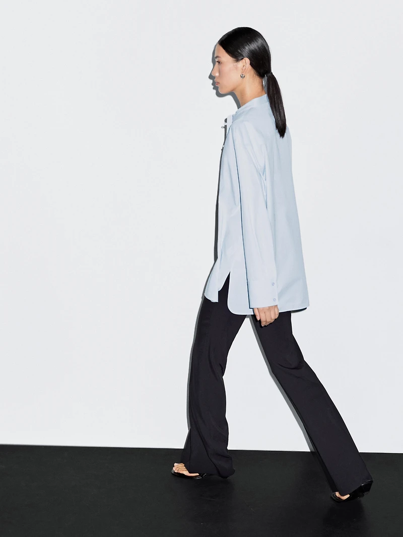 Shirt with stand collar and bib