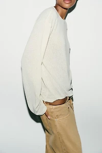 CUT-OUT KNIT SWEATER