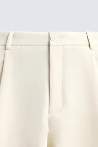 RELAXED FIT PLEATED PANTS