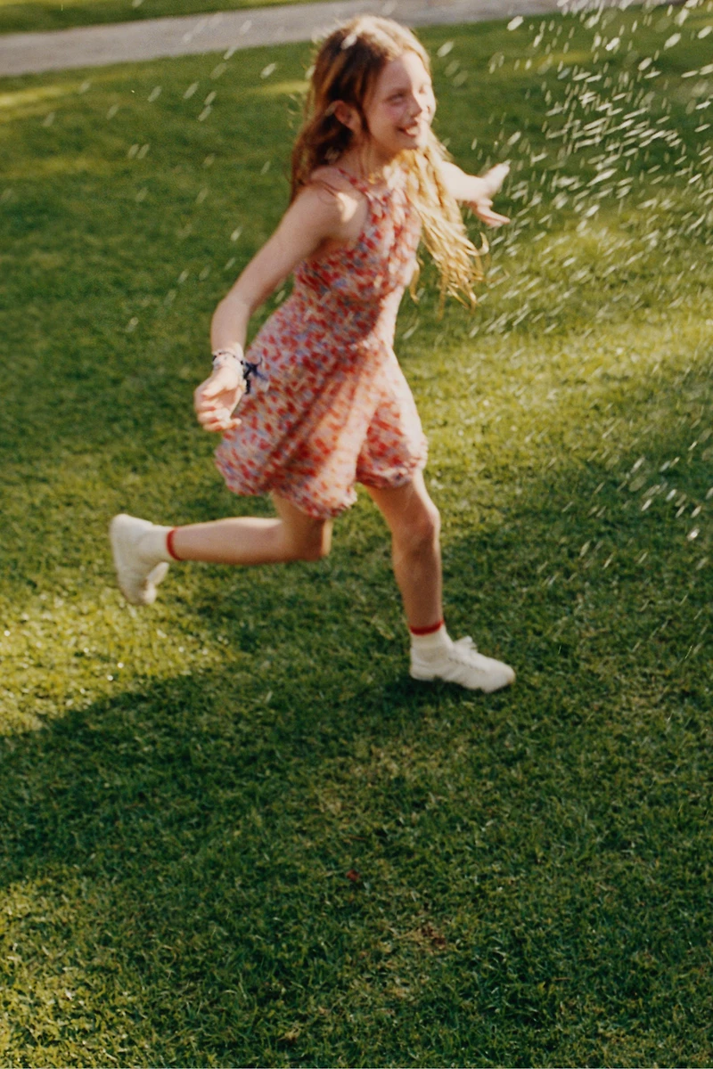 SHORT RUFFLED FLORAL JUMPSUIT
