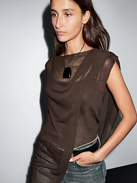 Cape en maille coupe asymétrique