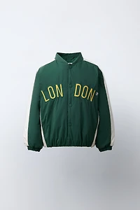 BLOUSON BOMBER CAPUCHE EN MOLLETON AMOVIBLE DÉPERLANT