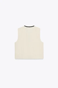 GILET BRODÉ À POMPONS