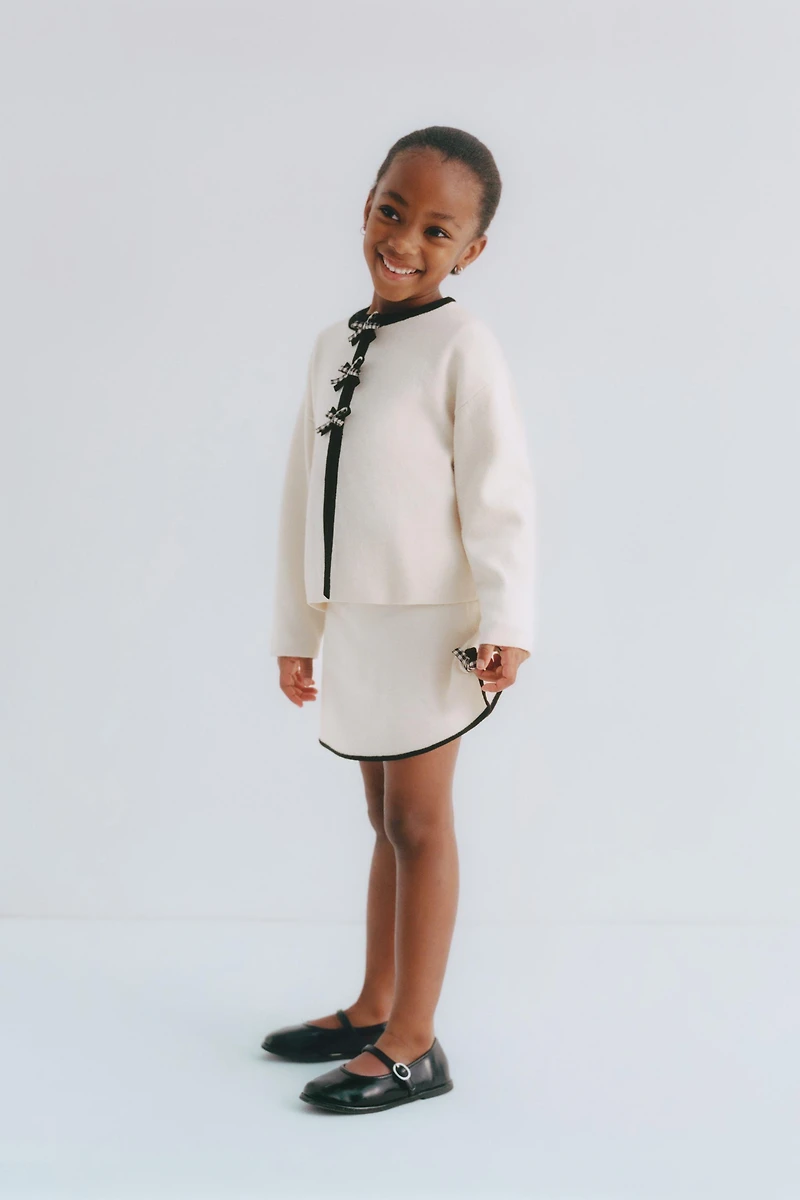 CONTRAST BOW KNIT SKIRT