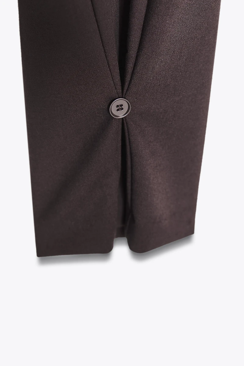 PLEATED PANTS WITH BUTTON HEM