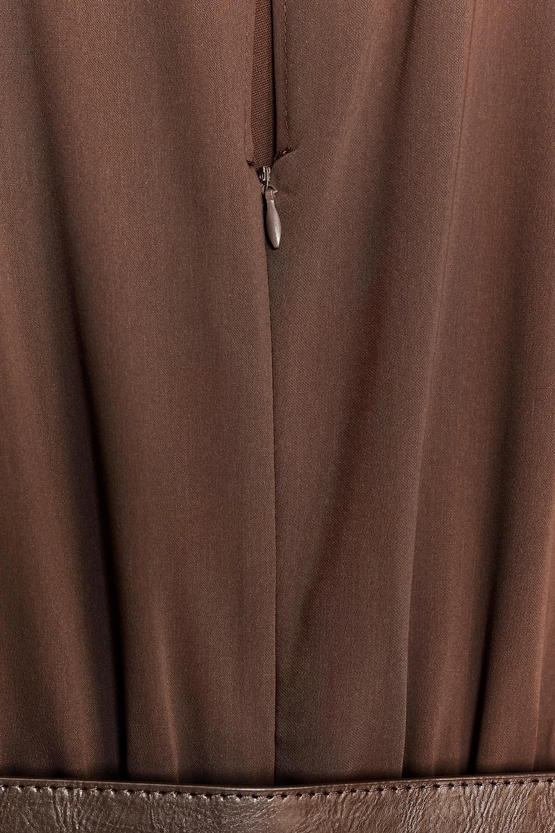 SLEEVELESS BELTED JUMPSUIT