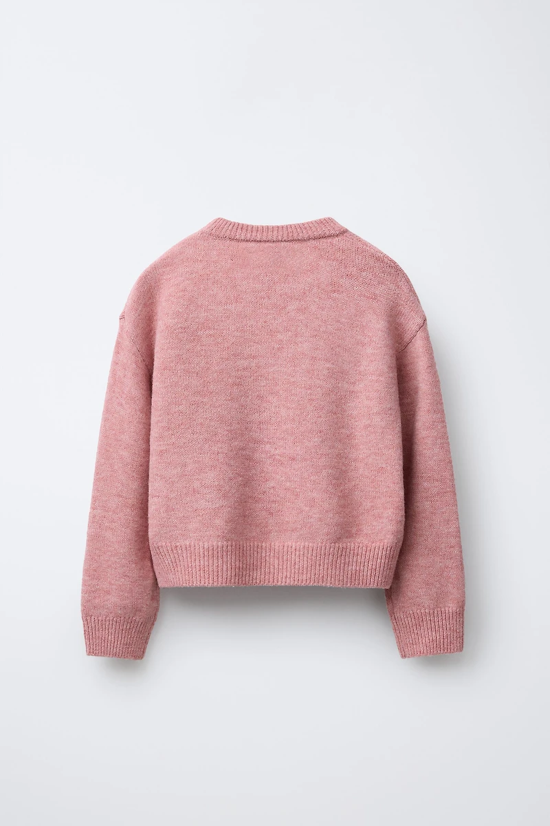 PULL EN MAILLE À FLEURS ET FANTAISIE