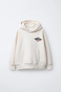 SWEAT À CAPUCHE IMPRIMÉ INSCRIPTION FLOQUÉE