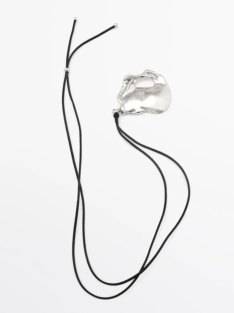 Pendentif pièce abstraite