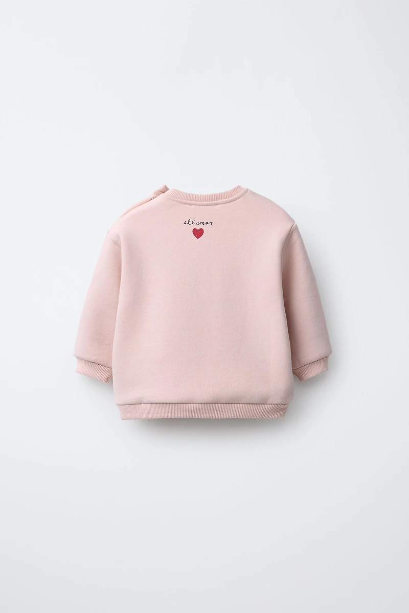 SWEAT BRODÉ SNOOPY PEANUTS™