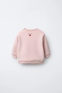 SWEAT BRODÉ SNOOPY PEANUTS™