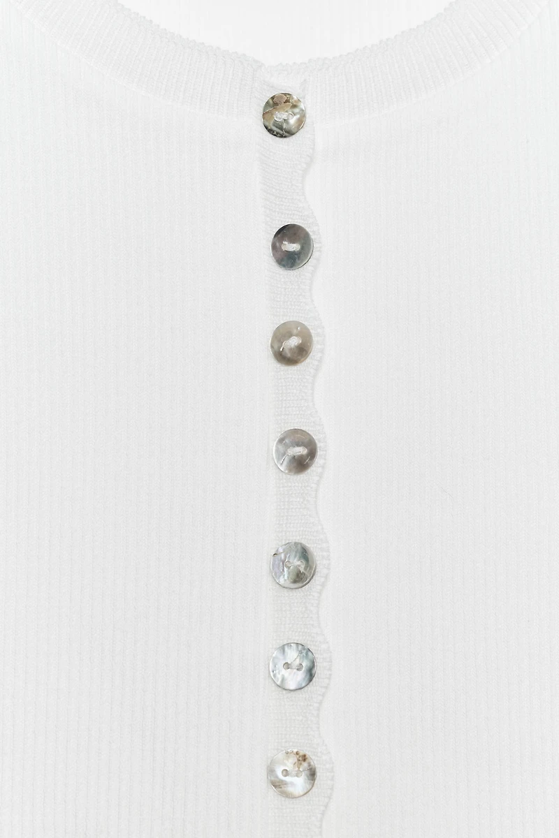 TOP À BOUTONS
