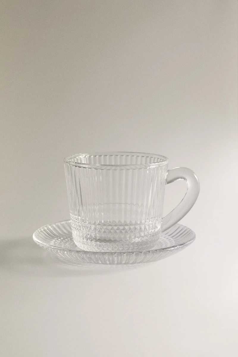 COFFEE CUP AND SAUCER WITH RAISED GEOMETRIC DESIGN