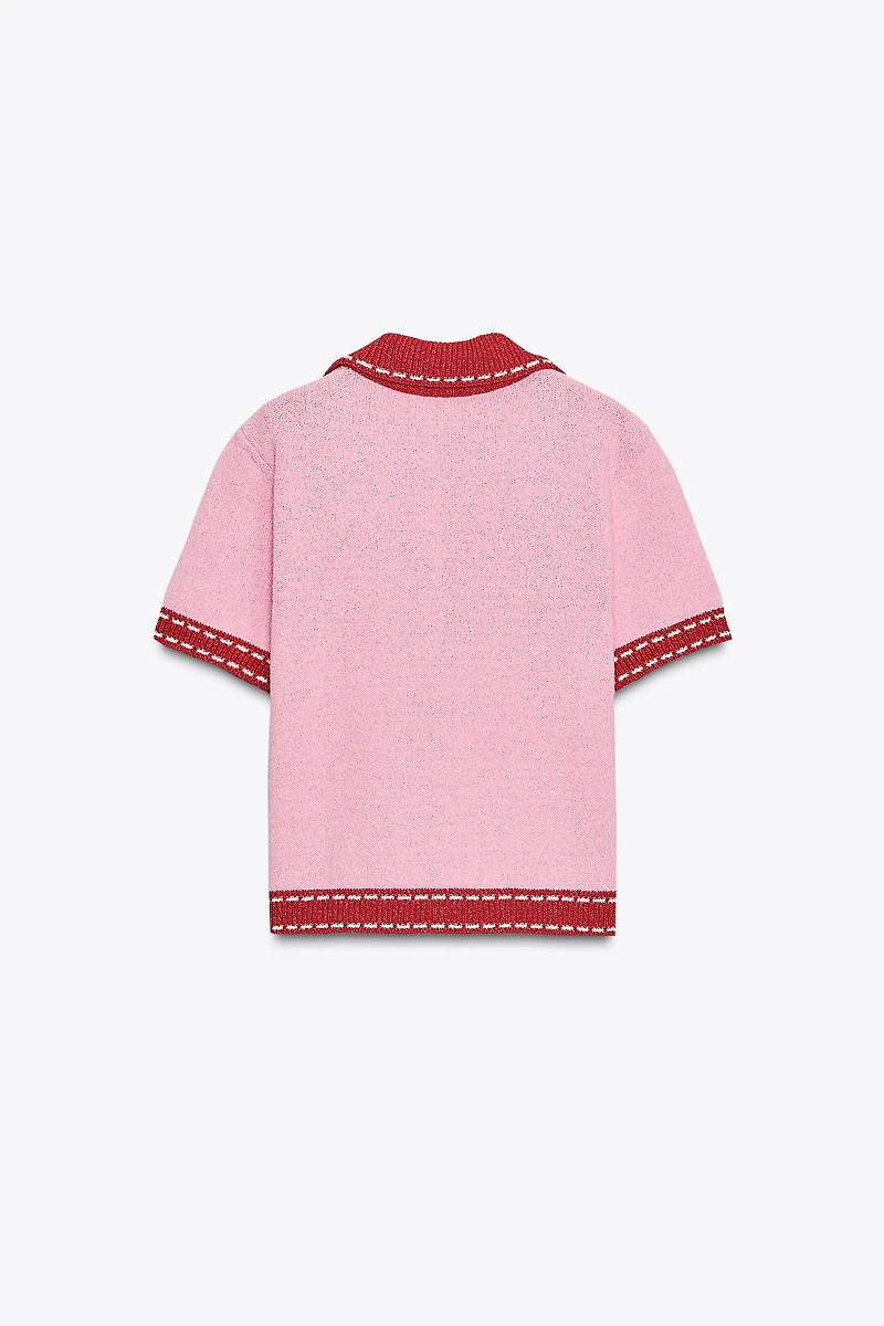 VESTE EN MAILLE SURPIQÛRES MANCHES COURTES
