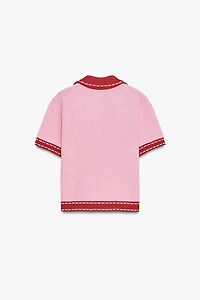 VESTE EN MAILLE SURPIQÛRES MANCHES COURTES