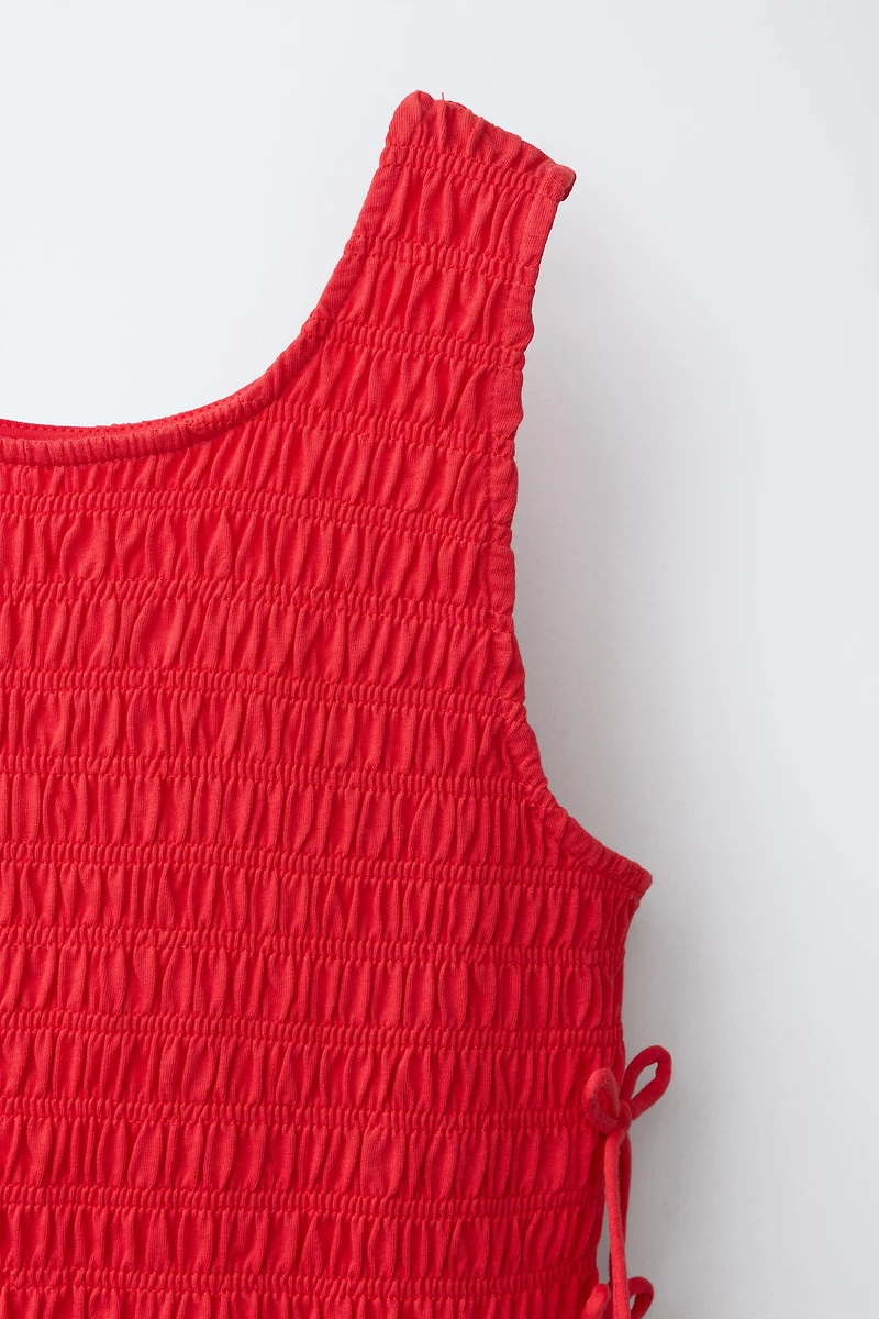 ELASTICIZED TIE TOP