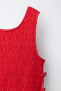 ELASTICIZED TIE TOP
