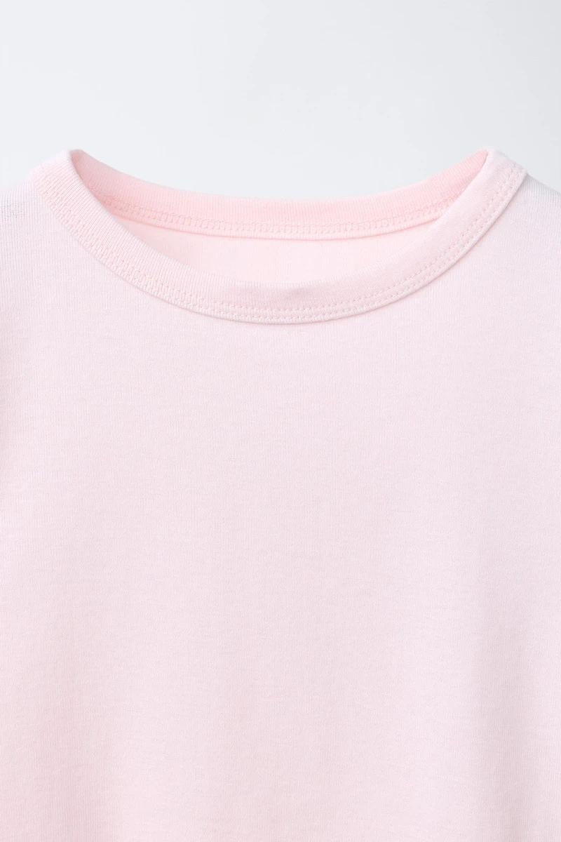 MODAL T-SHIRT WITH CUT OUTS AND BOWS