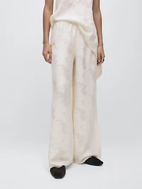 Flowing stretch trousers with fabric detail