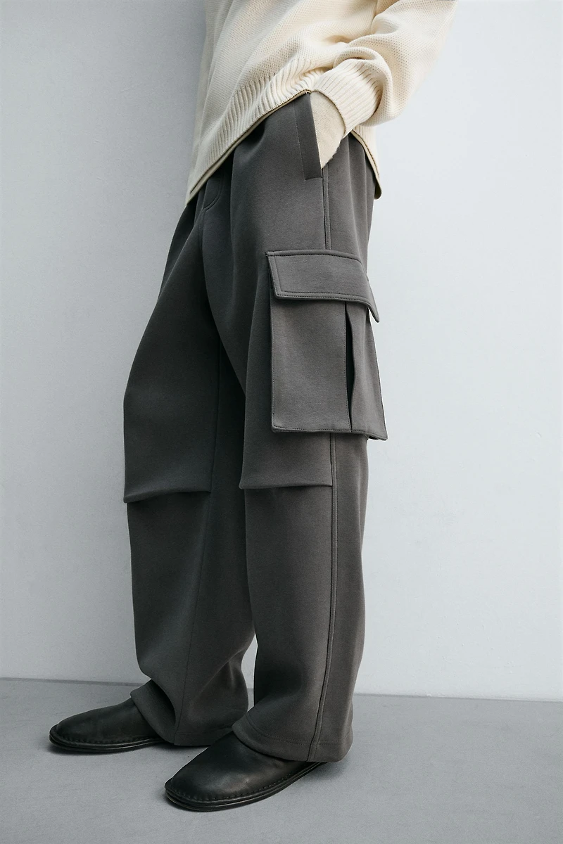 NEOPRENE EFFECT CARGO PANTS WITH PLEATS