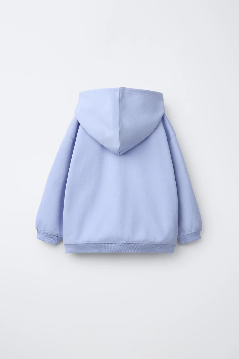 INTERLOCK ZIP SWEATSHIRT WITH RAISED TEXT