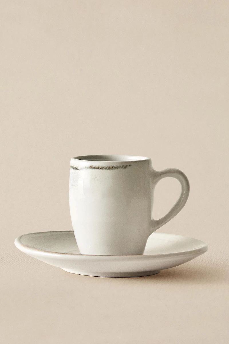 STONEWARE COFFEE CUP AND SAUCER