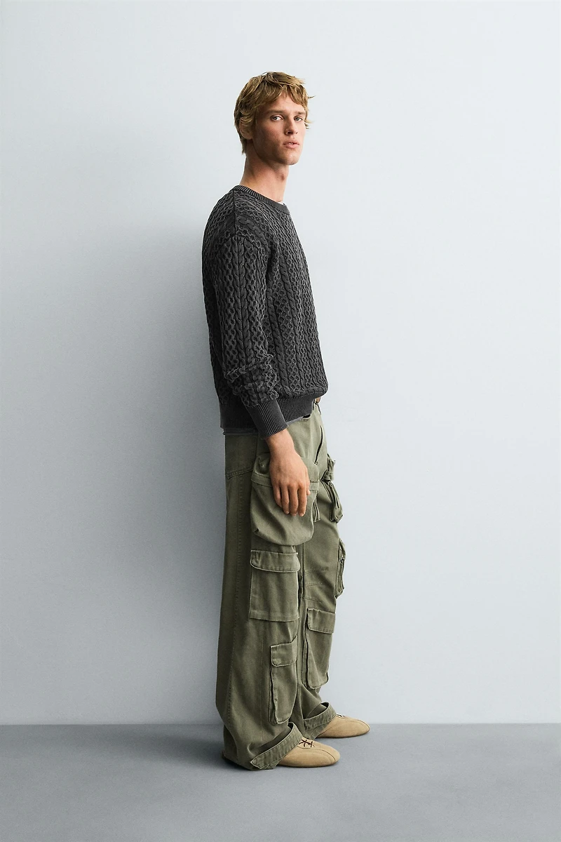 GARMENT-DYED CABLE KNIT SWEATER